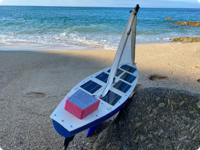 Epsom College's Boat on the beach before launch